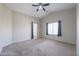 Neutral bedroom with neutral carpets and curtains providing a calming space at 41388 W Hopper Dr, Maricopa, AZ 85138