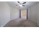 Neutral bedroom with a ceiling fan and comfortable carpeting, ready for personalized decor at 41388 W Hopper Dr, Maricopa, AZ 85138