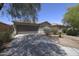 Charming single-story home featuring a two-car garage and low maintenance desert landscaping at 41388 W Hopper Dr, Maricopa, AZ 85138