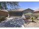 Charming single-Gathering home featuring a two-car garage and desert landscaping at 41388 W Hopper Dr, Maricopa, AZ 85138