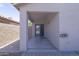 Covered patio with concrete flooring and a sliding glass door entry at 41388 W Hopper Dr, Maricopa, AZ 85138
