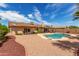 Expansive backyard with pool, mature landscaping, and desert accents, creating a private retreat at 4245 E Yawepe St, Phoenix, AZ 85044