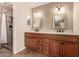 Spacious bathroom featuring a dual sink vanity and a walk-in shower at 4245 E Yawepe St, Phoenix, AZ 85044