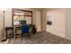 Bedroom or office space with work desk and natural light, offering a flexible layout at 4245 E Yawepe St, Phoenix, AZ 85044