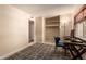 Well-lit room featuring modern furnishings and built-in shelves and closet at 4245 E Yawepe St, Phoenix, AZ 85044