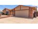 A single-story home with a two car garage and desert landscaping at 4245 E Yawepe St, Phoenix, AZ 85044