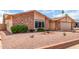 Lovely single-story home with desert landscaping, small plants, and red rock at 4245 E Yawepe St, Phoenix, AZ 85044