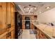 The kitchen features custom cabinets, modern appliances, and tile countertops at 4245 E Yawepe St, Phoenix, AZ 85044