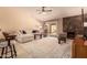 Bright living room with stone fireplace, ceiling fan, and sliding glass door at 4245 E Yawepe St, Phoenix, AZ 85044