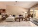 Spacious living room with white furniture and view of the outdoor patio at 4245 E Yawepe St, Phoenix, AZ 85044