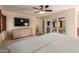 Cozy main bedroom with mirrored closet, ceiling fan, and bright natural light at 4245 E Yawepe St, Phoenix, AZ 85044