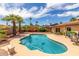 Lush backyard oasis featuring a sparkling pool, landscaped gardens, and inviting patio area at 4245 E Yawepe St, Phoenix, AZ 85044