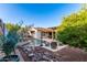 Gorgeous backyard featuring a pool, covered patio, pergola, desert landscaping, and outdoor seating at 4282 N 180Th Dr, Goodyear, AZ 85395