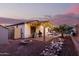 Outdoor space with patio, fire pit, built-in grill, and charming landscaping at 4282 N 180Th Dr, Goodyear, AZ 85395