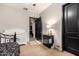 Bright bedroom featuring a crib and nightstand with a lamp at 4282 N 180Th Dr, Goodyear, AZ 85395