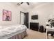 Spacious bedroom with a queen bed, dark dresser, and makeup vanity at 4282 N 180Th Dr, Goodyear, AZ 85395