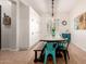 The room features tiled flooring, a dining table, and ample storage cabinets at 4282 N 180Th Dr, Goodyear, AZ 85395