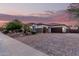A charming single-story home with a three-car garage and a brick-paved driveway at 4282 N 180Th Dr, Goodyear, AZ 85395