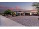 A charming single-story home with a three-car garage and a brick-paved driveway at 4282 N 180Th Dr, Goodyear, AZ 85395