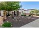 Charming single-story home featuring desert landscaping, stone accents, and inviting curb appeal at 4282 N 180Th Dr, Goodyear, AZ 85395
