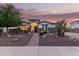Charming single-story home featuring decorative rock landscaping and a brick walkway leading to the front door at 4282 N 180Th Dr, Goodyear, AZ 85395