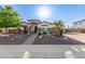 Charming single-story home featuring decorative rock landscaping and a brick walkway leading to the front door at 4282 N 180Th Dr, Goodyear, AZ 85395