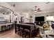 Comfortable living space open to kitchen featuring a bar height table and multiple seating options at 4282 N 180Th Dr, Goodyear, AZ 85395