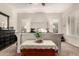 Main bedroom has large bed with crisp white linens and neutral decor at 4282 N 180Th Dr, Goodyear, AZ 85395