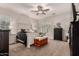 Main bedroom with neutral walls, ceiling fan and shuttered windows at 4282 N 180Th Dr, Goodyear, AZ 85395