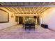 Undercover patio with tile flooring, string lights and outdoor dining area at 4282 N 180Th Dr, Goodyear, AZ 85395