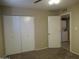 Bedroom with closet, carpet and view to laundry room at 430 W Santa Cruz Dr, Tempe, AZ 85282