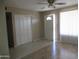 Bright living room with ceiling fan, tile floors, closet, and natural light at 430 W Santa Cruz Dr, Tempe, AZ 85282