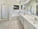 Bathroom with tile floors, tub and shower with glass doors, and large vanity at 4626 E Villa Rita Dr, Phoenix, AZ 85032