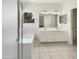 Bright bathroom with double sinks, a bathtub, and glass shower at 4626 E Villa Rita Dr, Phoenix, AZ 85032
