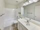 Clean, all-white bathroom featuring a shower-tub combination, vanity, and medicine cabinet at 4626 E Villa Rita Dr, Phoenix, AZ 85032