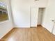 Well-lit bedroom with closet and wood-look floors, providing a calm and welcoming atmosphere at 4626 E Villa Rita Dr, Phoenix, AZ 85032