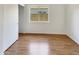 Bright bedroom with wood-look flooring and closet, ideal for relaxation and rest at 4626 E Villa Rita Dr, Phoenix, AZ 85032