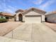 Charming single-story home with a two-car garage, low maintenance landscaping, and a classic Southwestern design at 4626 E Villa Rita Dr, Phoenix, AZ 85032