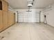Spacious two-car garage with built in cabinets for plenty of storage and organization at 4626 E Villa Rita Dr, Phoenix, AZ 85032