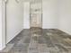 Open-concept living area with tile floors, bright lighting, and hallway access at 4626 E Villa Rita Dr, Phoenix, AZ 85032