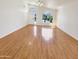 Spacious living room features gleaming wood floors and bright natural light at 4626 E Villa Rita Dr, Phoenix, AZ 85032