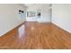 Bright living room features gleaming wood floors and bright natural light at 4626 E Villa Rita Dr, Phoenix, AZ 85032