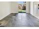 Spacious living area with slate floors and sliding glass door to backyard at 4626 E Villa Rita Dr, Phoenix, AZ 85032