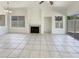 Bright living room with fireplace, tile flooring, ceiling fan, and windows for lots of natural light at 4626 E Villa Rita Dr, Phoenix, AZ 85032