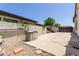 Backyard view with gravel and cement, with outdoor storage and access to other yards at 4706 E Des Moines St, Mesa, AZ 85205