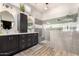 Sleek primary bath with dual vanities, soaking tub, and glass-enclosed shower with grey tile at 4706 E Des Moines St, Mesa, AZ 85205