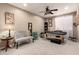 Spacious bedroom with carpet, ceiling fan, and a tufted bench perfect for relaxing or hobbies at 4706 E Des Moines St, Mesa, AZ 85205