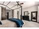 Primary bedroom showcasing a four poster bed, dark wood dresser and a decorative leaner mirror at 4706 E Des Moines St, Mesa, AZ 85205