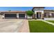 Charming single-Gathering home with a three-car garage, tile roof, and well-manicured lawn at 4706 E Des Moines St, Mesa, AZ 85205