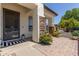 Inviting front porch with stone pillars, and patterned welcome mat at 4706 E Des Moines St, Mesa, AZ 85205
